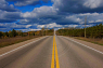 Suny day with white clouds on the road to Wasaga Beach